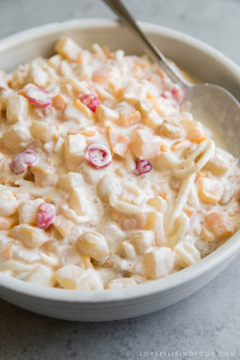 chilled Filipino fruit salad in large serving bowl with serving spoon.