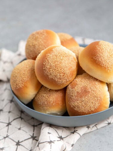 filipino pandesal bread in bowl.