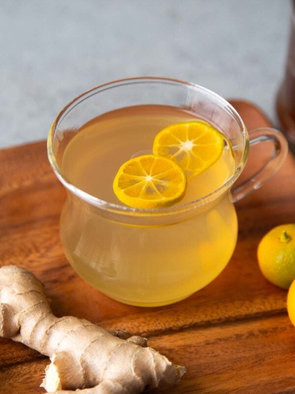 ginger tea garnished with citrus wheel.