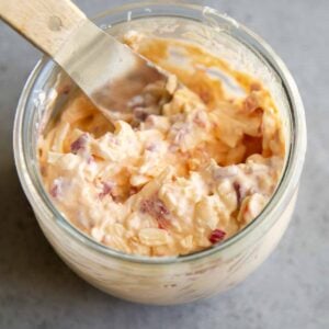 Filipino pimiento cheese spread in a glass jar.