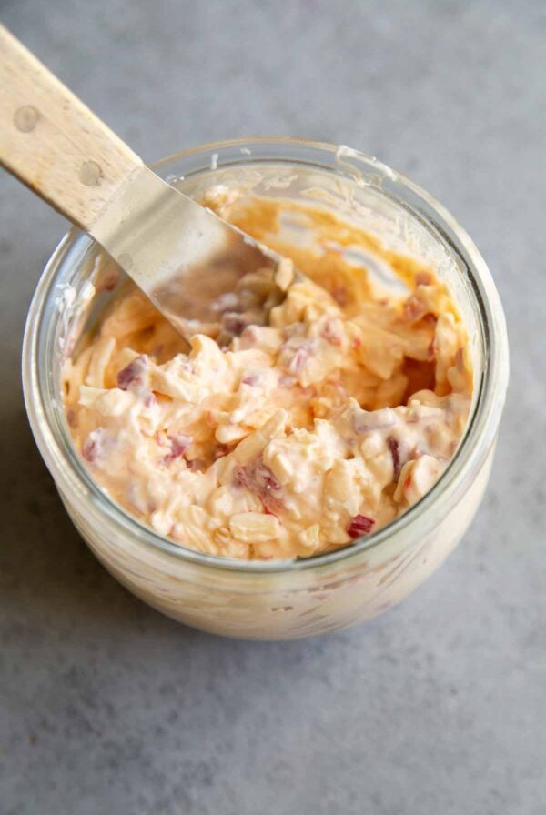 Filipino pimiento cheese spread in a glass jar.