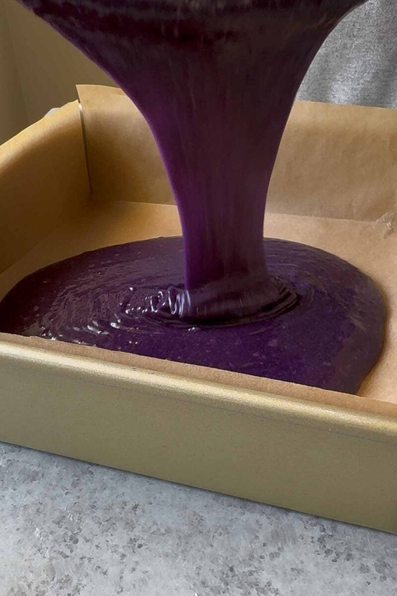 pour batter into prepared baking pan.