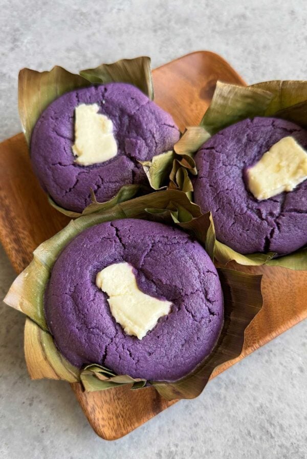 ube bibingka with cream cheese baked in banana leaf.