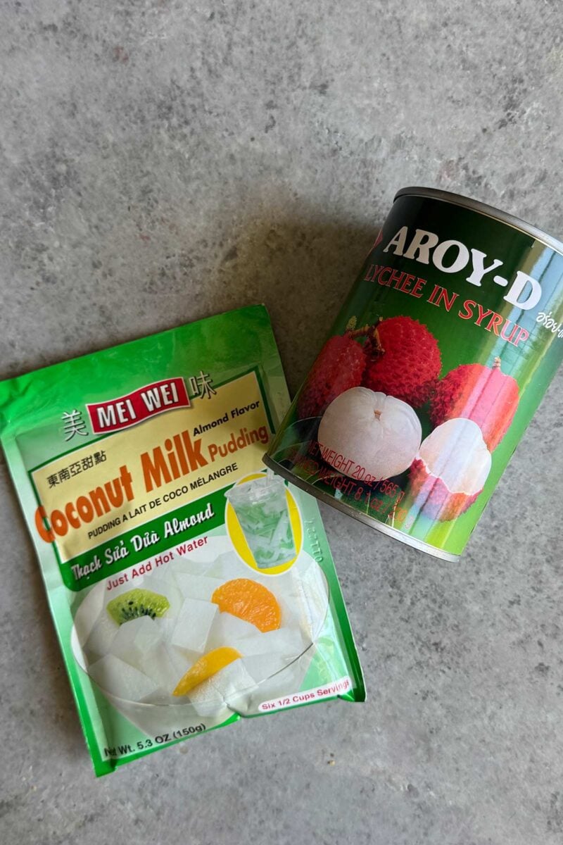 almond jelly mix package and a can of lychee fruit.
