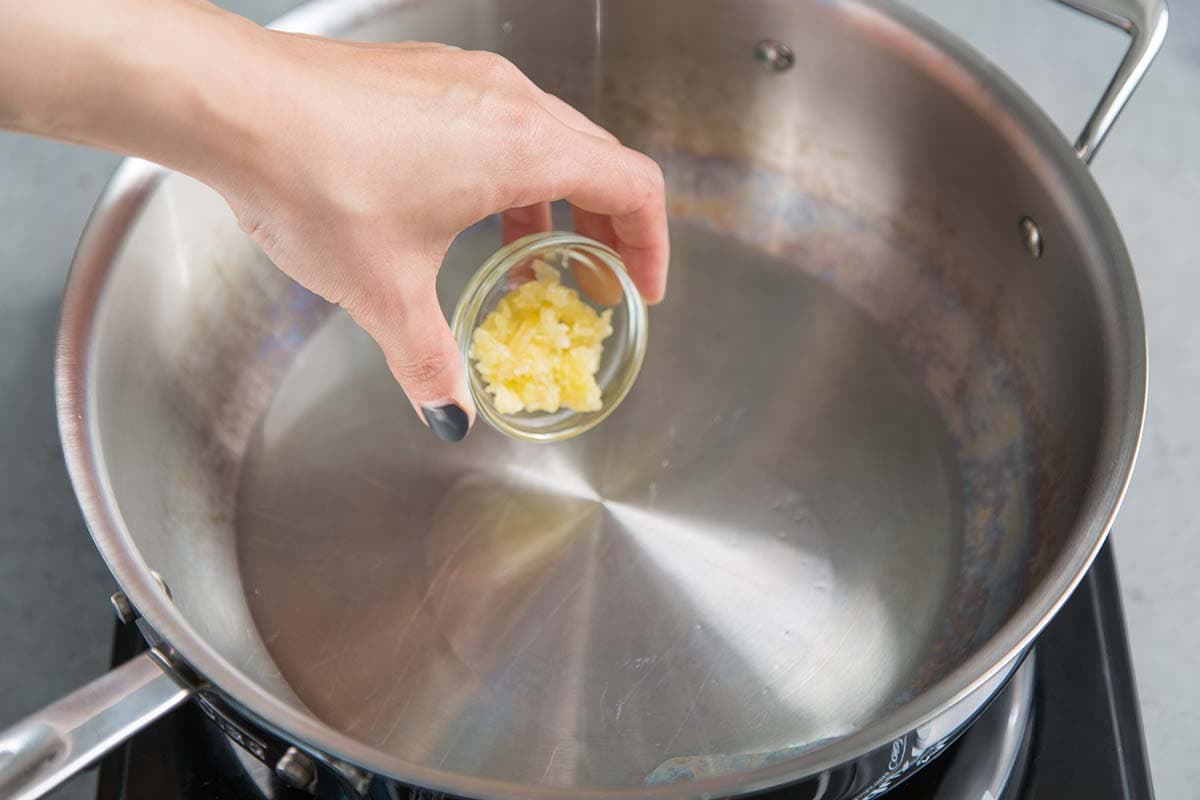 add minced garlic to hot oiled skillet.