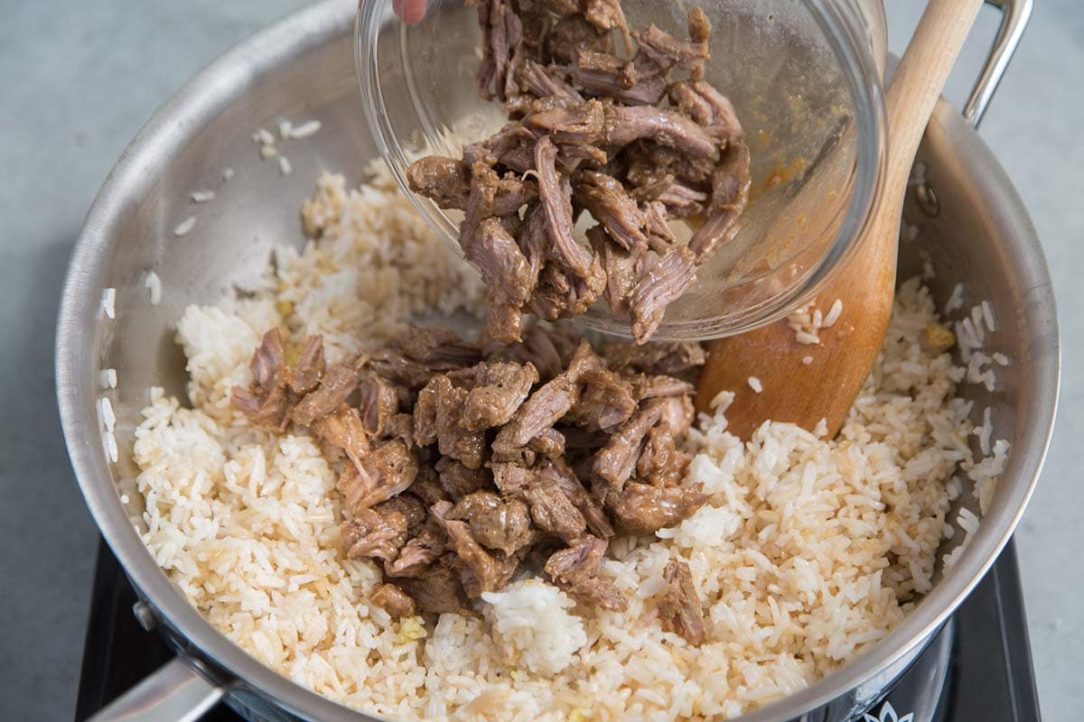 add shredded pork adobo to rice mixture.