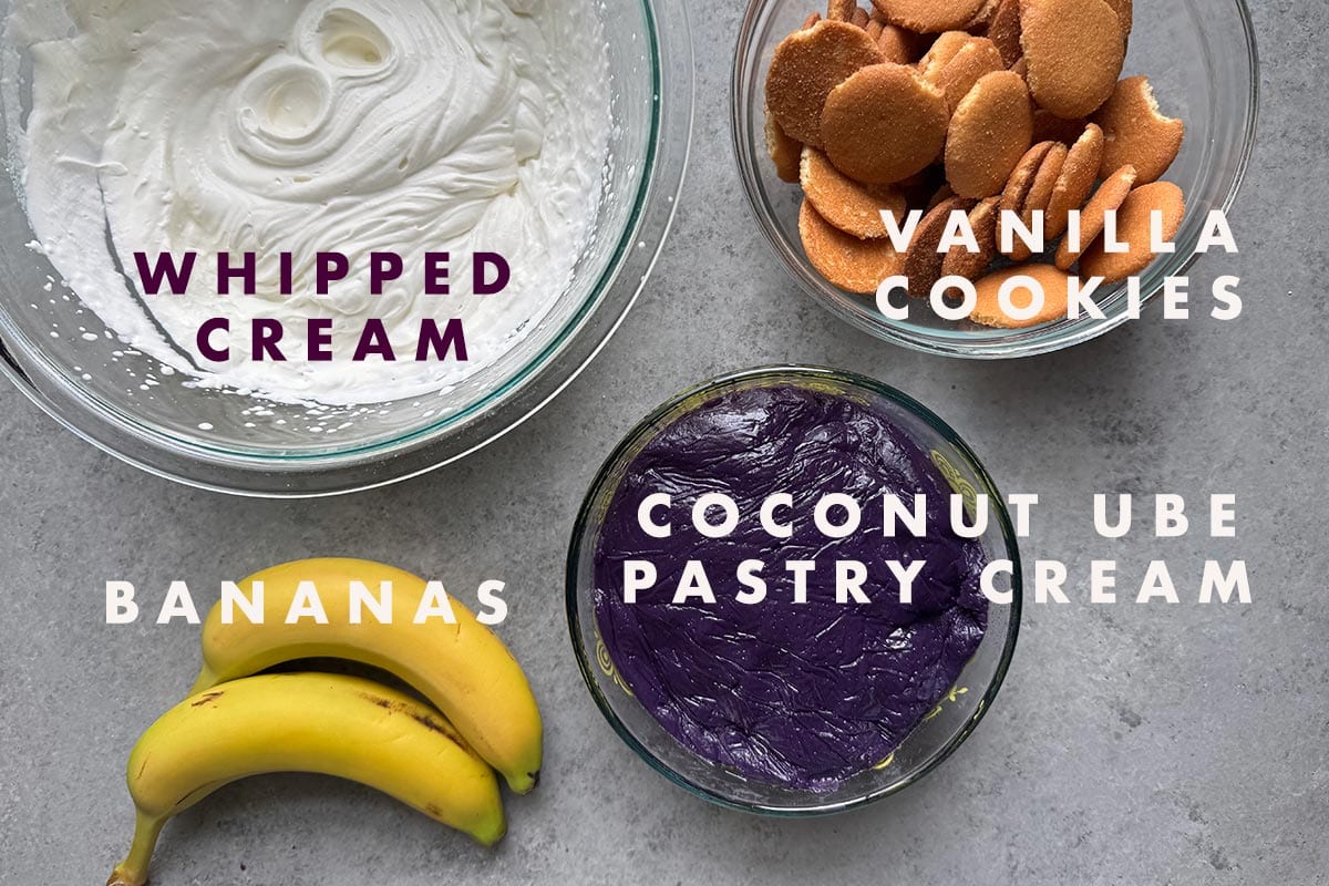 bowl of whipped cream, vanilla cookies, coconut ube pastry cream, and two bananas.