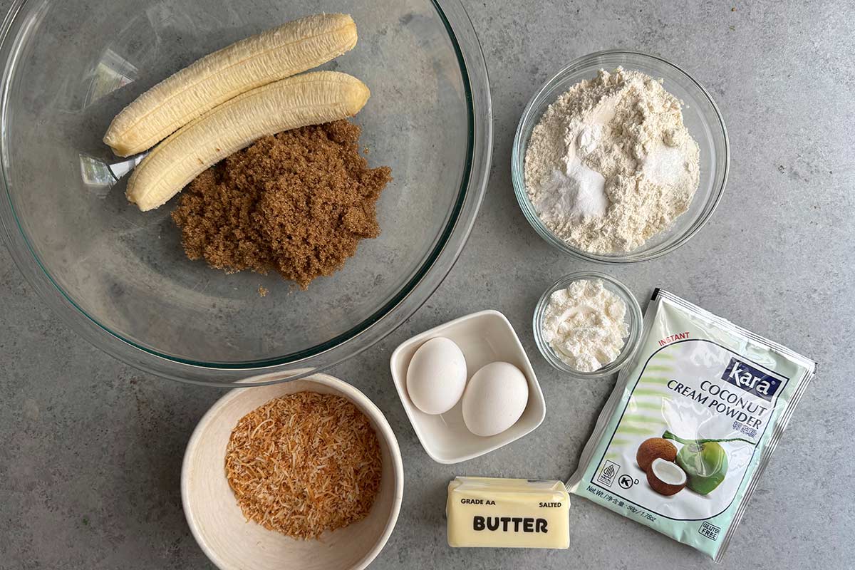 overhead portion out ingredients needed to make coconut banana bread.