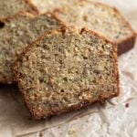 coconut banana bread slices on parchment paper.