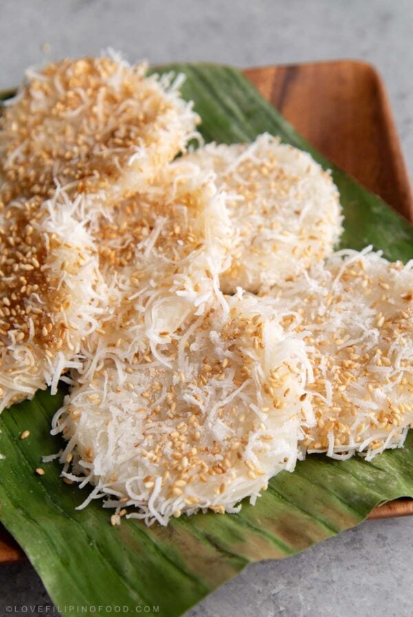 shredded coconut palitaw rice cake on banana leaf.